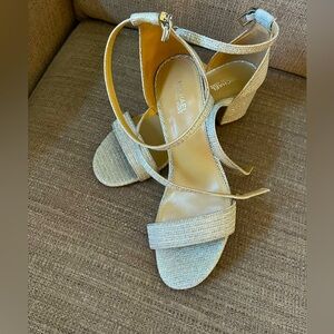 Michael Kors “Serena Flex” silver sandal. Never worn.